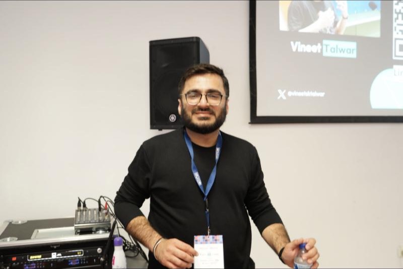 Vineet smiling after a talk